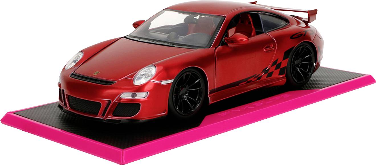 'A red sports car toy model on a pink and black pedestal, showing sleek design and black racing stripes.'