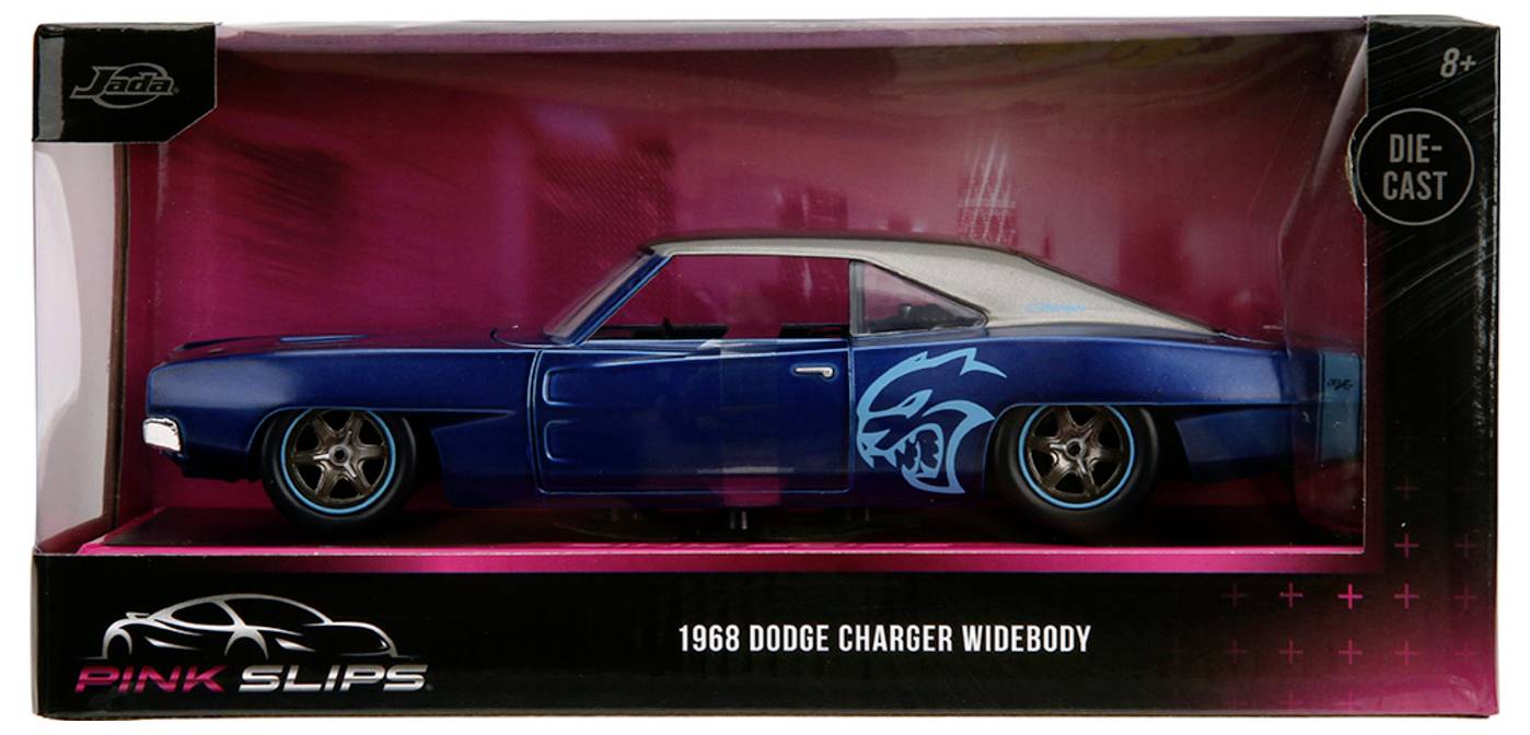 A die-cast model of a 1968 Dodge Charger Widebody in blue, displayed in a hot pink and black box. The box labels the model for ages 8 and up.