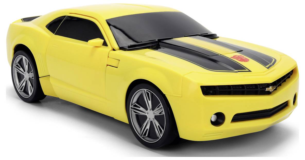 A yellow toy car with black racing stripes and a red emblem on the hood, resembling a sports car model, shown from a front angle.