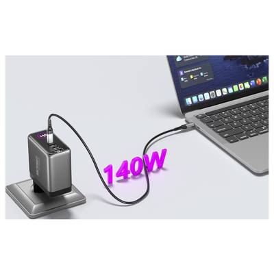 A laptop connected to a power adapter labeled '140W', indicating high-speed charging. The screen shows notifications and app icons.