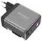 'A gray Voltcraft UC-100W01 wall charger with dual USB ports, suitable for fast charging. Plug fits European outlets.'