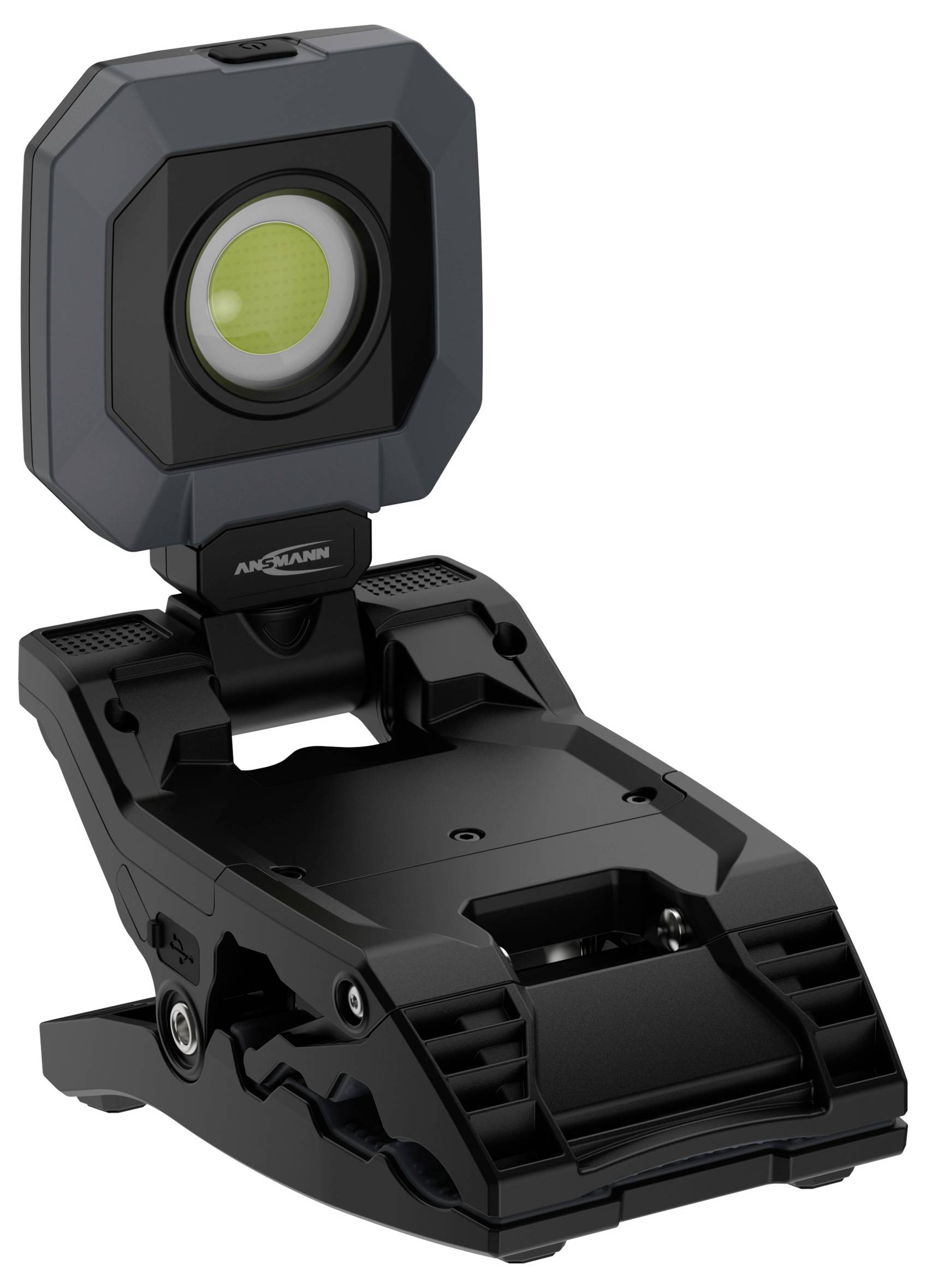 A compact LED work light with a clip base, designed for versatile mounting. The light has a prominent, circular lens in a protective casing.