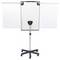 A white mobile flip chart easel with an adjustable height on a wheeled base, extended side panels, and a central clamp to hold paper.