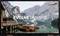 A serene lake with wooden boats at a dock, surrounded by mountains. The text 'EVOLVE DYNAMIC' appears over the image.