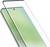 A smartphone with a light green display is overlaid with a transparent screen protector, highlighting its slim design and curved edges.