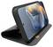 Smartphone in a black folding case, propped up horizontally. The screen displays an abstract design with blue and orange hues.