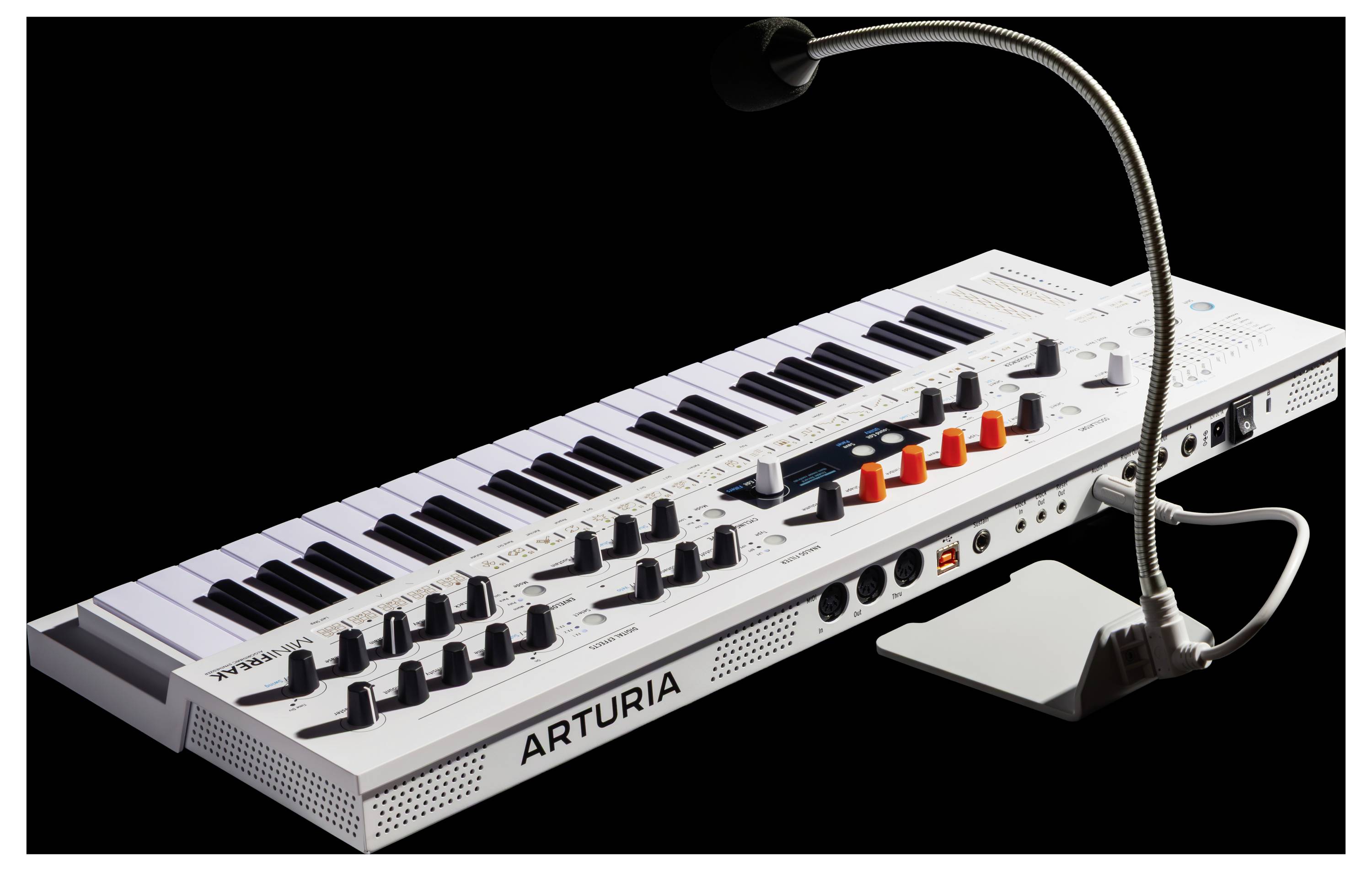 'A white Arturia synthesizer with a gooseneck microphone and multiple control knobs on a black background.'