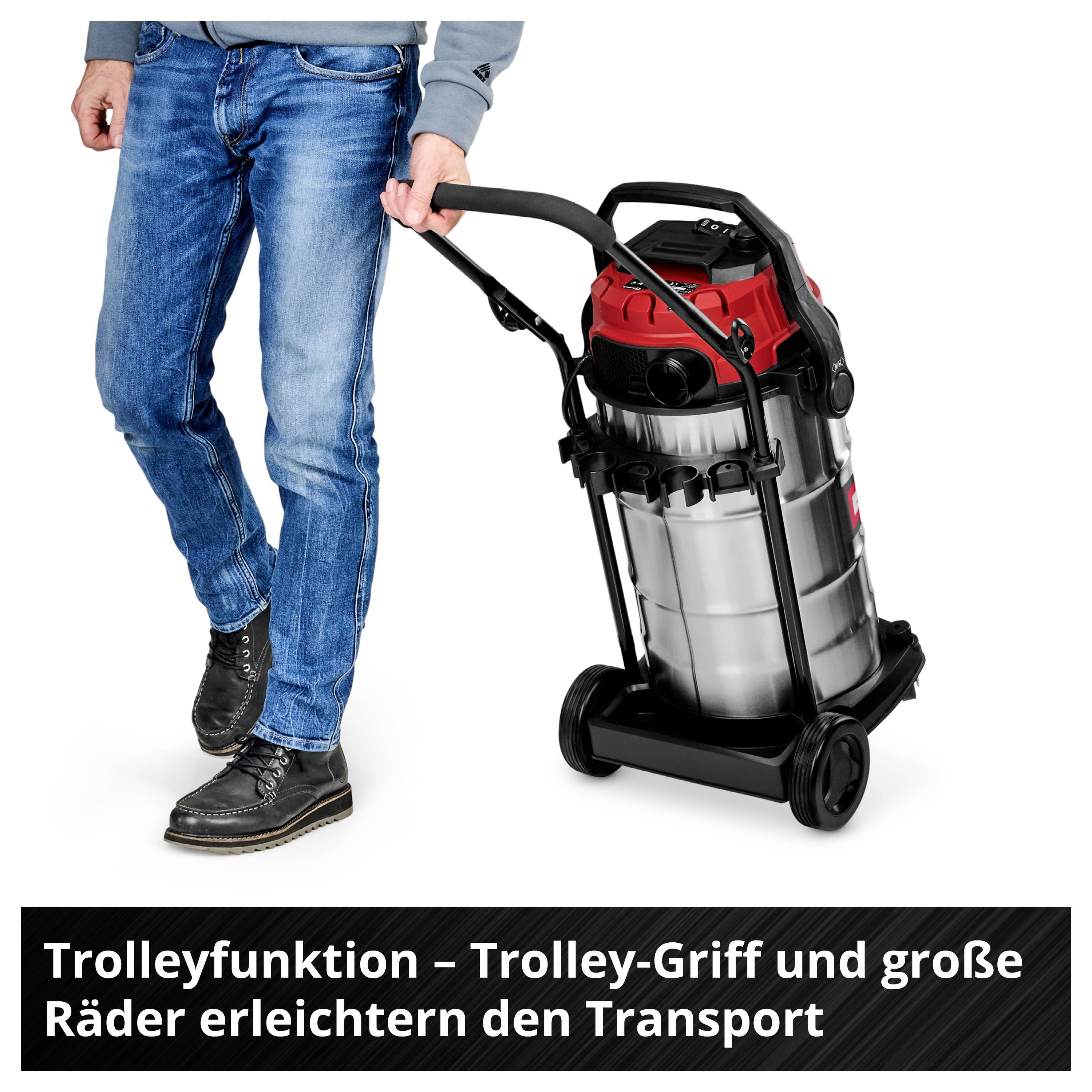 A man pulls a vacuum cleaner with a trolley handle. Text in the image: 'Trolley Function – Trolley Handle and Large Wheels Make Transport Easier'.