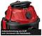 Red and black vacuum cleaner with cable winding mechanism on the handle for storing the power cable.