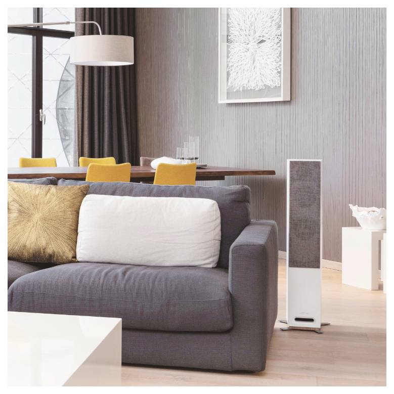 A modern living room with a gray sofa, yellow chairs, a dining table, and a floor-standing speaker. Large window and wall art in the background.