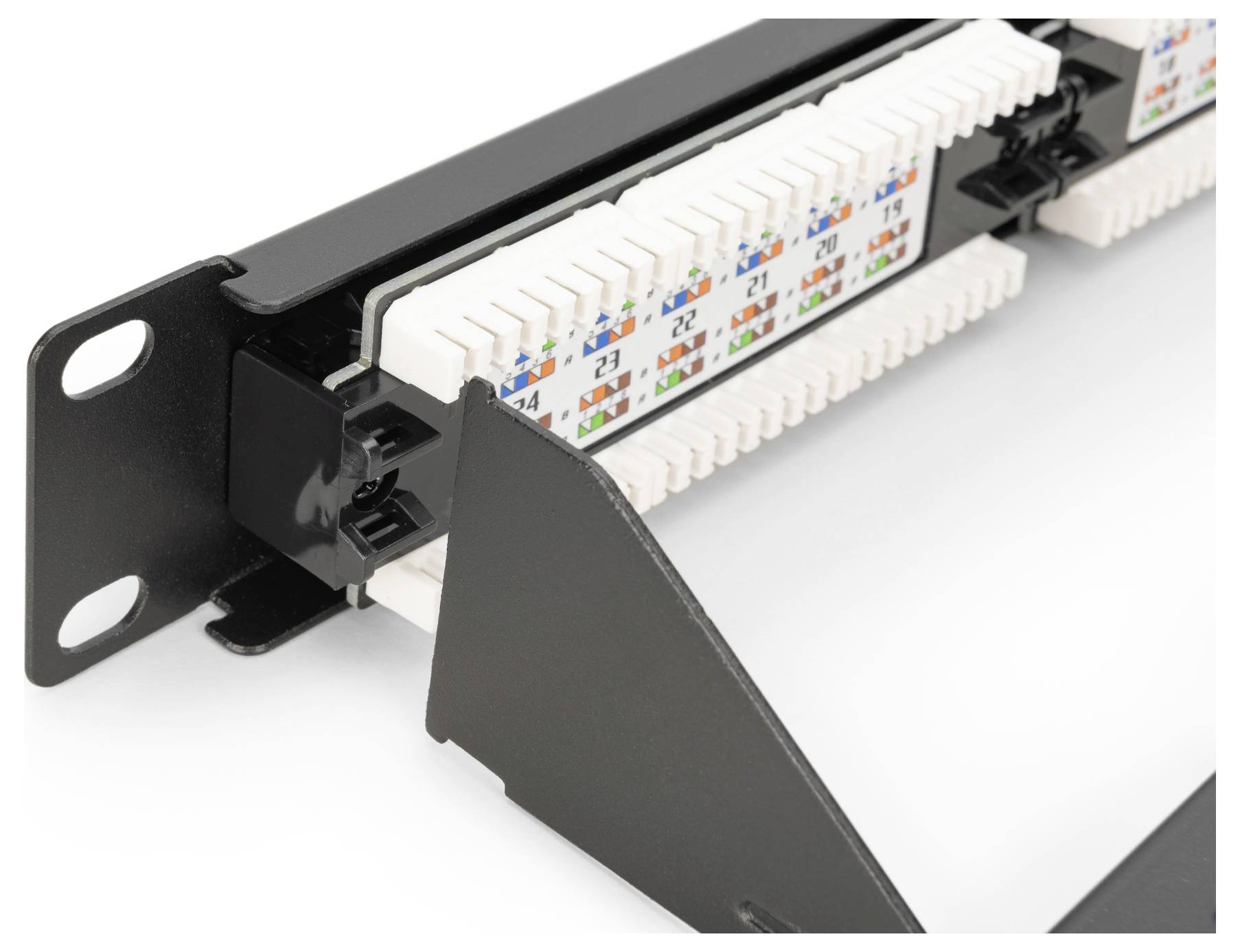 A close-up of a patch panel with color-coded wire connectors, showing numbered ports for network cable management in a server rack setup.