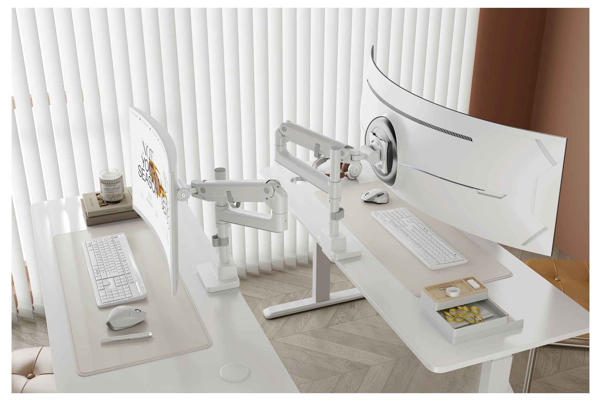 A modern dual-monitor setup on adjustable desks, featuring keyboards, a mouse, a trackpad, and a small organizer with office supplies.