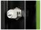 'Close-up of a metallic bolt secured through a black panel with a green background on the right side, illustrating hardware detail.'