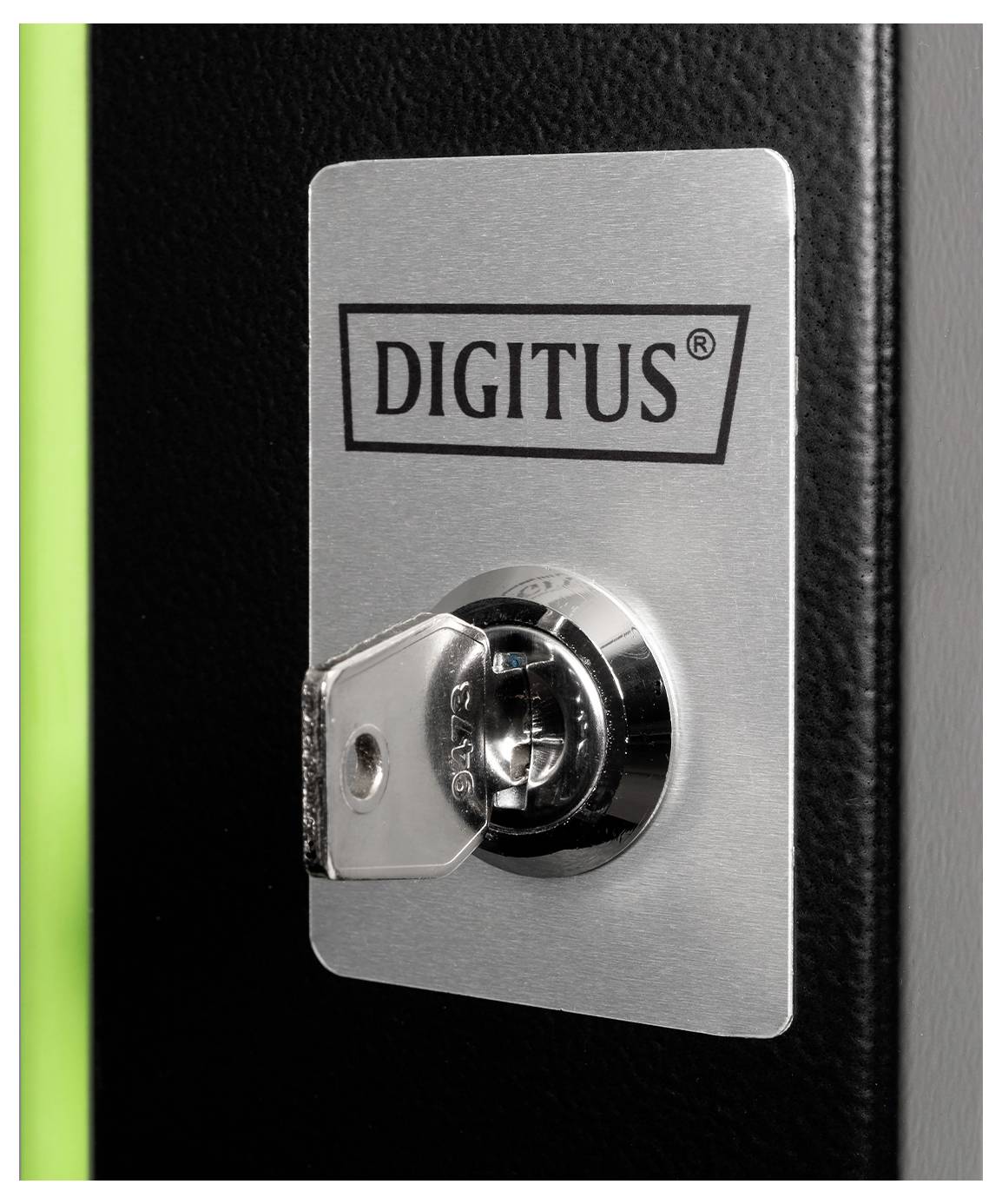 A metal lock with a key inserted, mounted on a surface labeled 'Digitus.'