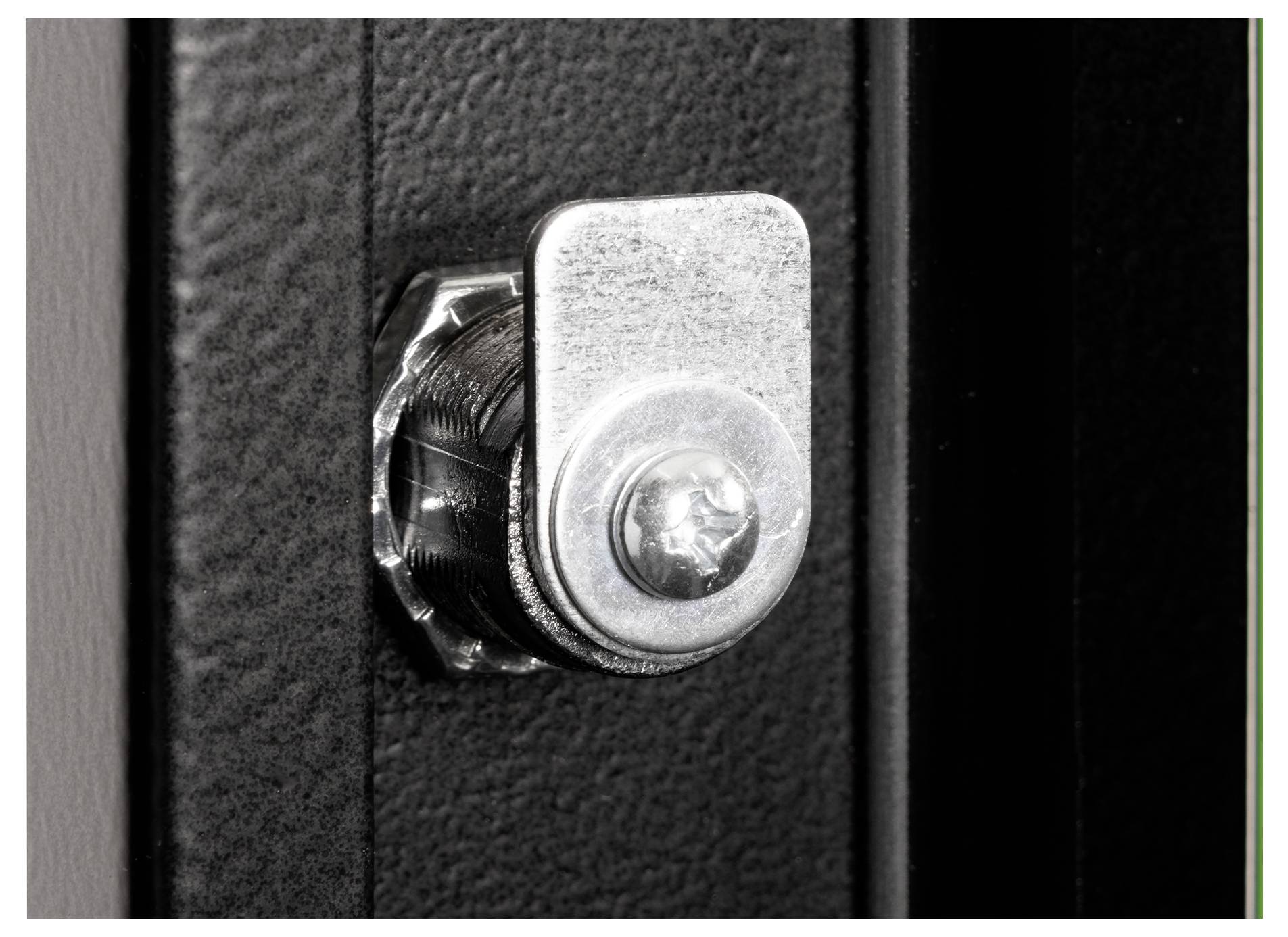 A close-up of a metal cam lock mounted on a dark surface. The lock has a rectangular rotating arm and is attached with a circular screw.