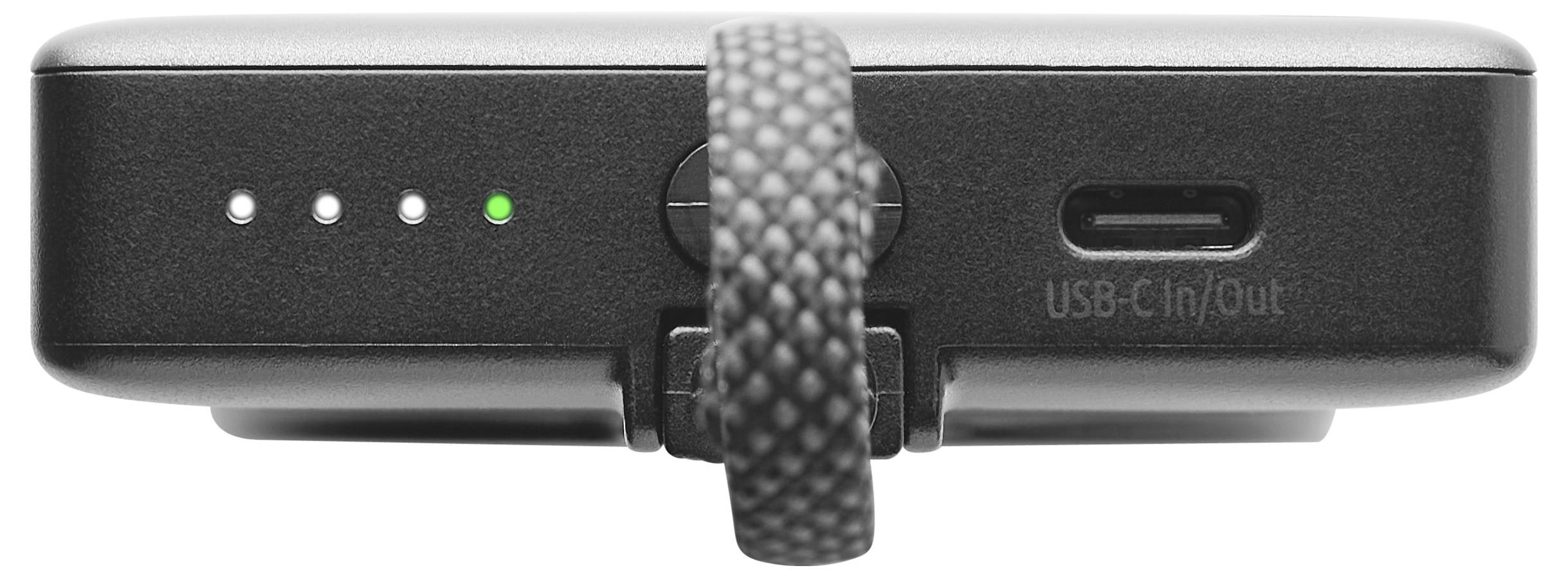 A black power bank with four LED lights and a green light is lit. A black textured strap is attached to the device.