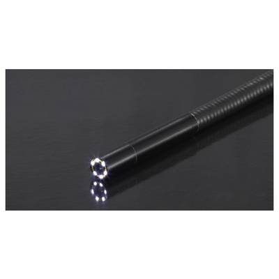 A flexible, black inspection tool with a lighted tip lies on a glossy, dark surface. The light at the tip reflects on the surface.