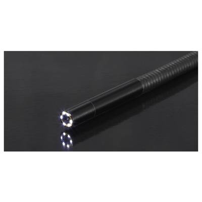 A black textured pen with its LED tip lit, casting a bright reflection on a glossy dark surface.
