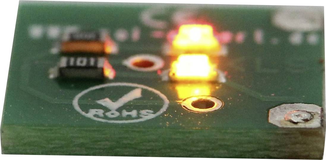 'A small green circuit board with a 'RoHS' compliance mark features two illuminated LEDs, one red and one yellow, on its surface.'