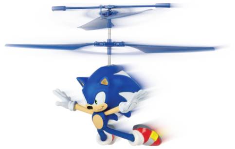 A toy helicopter featuring a blue cartoon character with large eyes and red shoes, spinning rapidly with extended arms, in mid-flight.