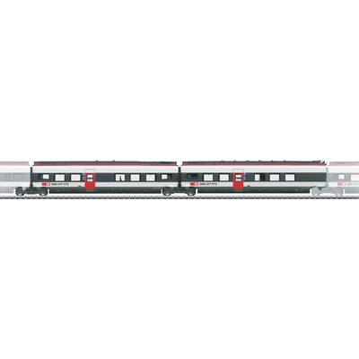 A sleek, modern train with red and gray coloring travels on a rail track.
