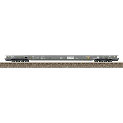 A gray railcar with safety symbols and identification markings is positioned on a track, showcasing wheels and company logos.
