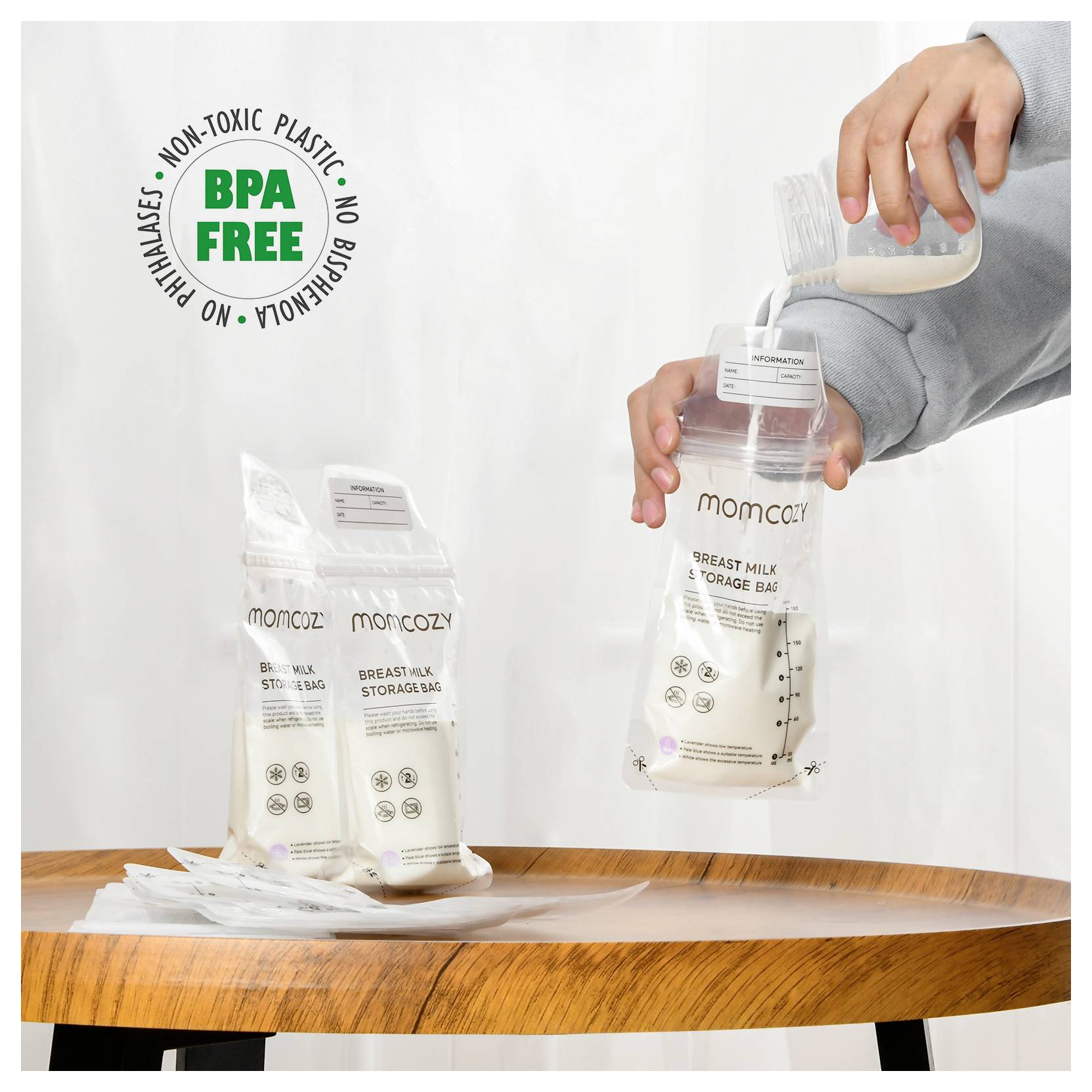 A person pours liquid into a 'Momcozy Breast Milk Storage Bag'. The package highlights 'BPA-Free' and 'Non-Toxic Plastic'.