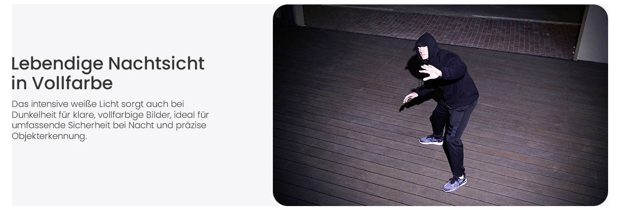 A person in a dark outfit is captured at night by a camera with bright illumination, emphasizing clear full-color night vision capabilities.