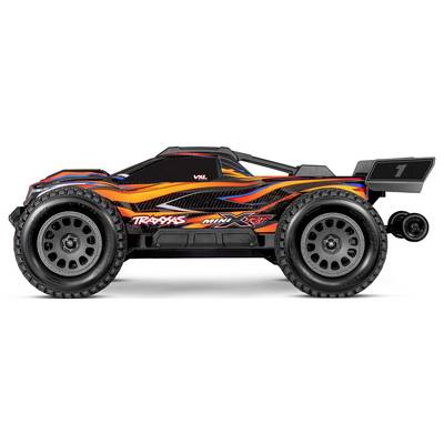 A detailed side view of an orange and black remote-controlled car with large wheels and flame-like patterns on the body.