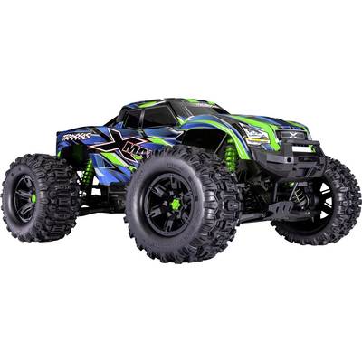 A blue and green remote-controlled off-road monster truck with large black tires, designed for high-performance on rough terrains.