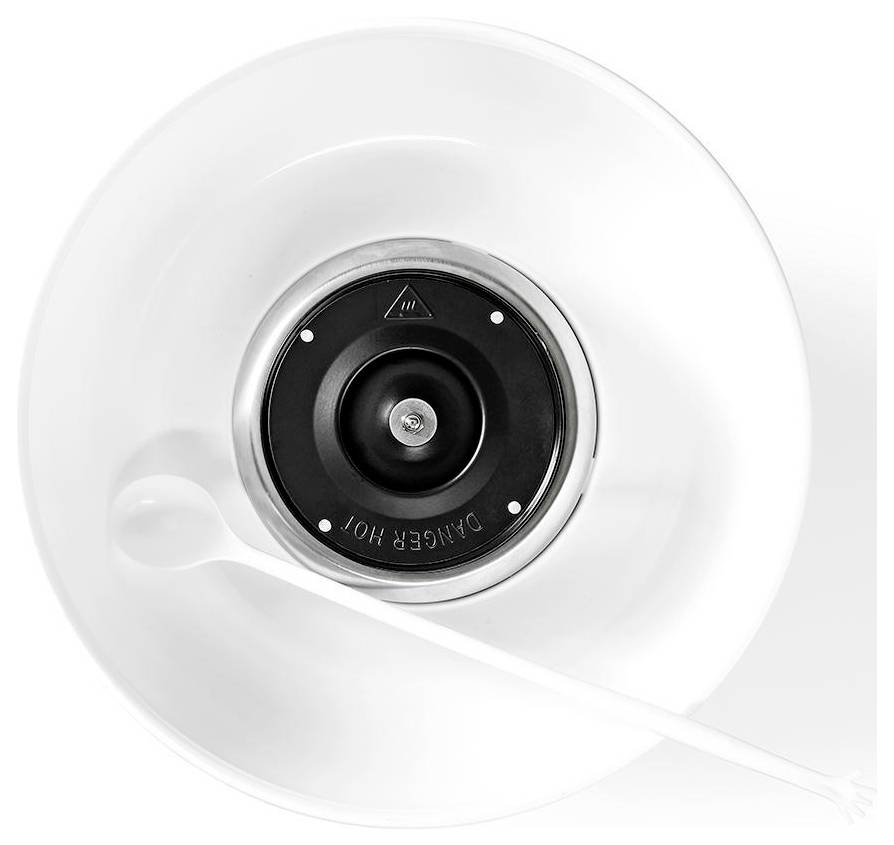 A black and white kitchen mixer bowl viewed from above, with a rotating tool labeled 'DANGER HOT' and a plastic spoon inside.