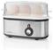 An electric egg boiler with a stainless steel base and transparent lid, containing three visible eggs positioned vertically.
