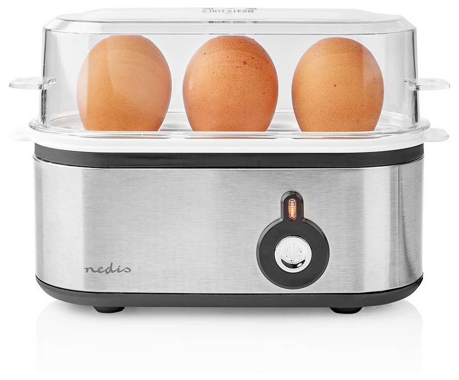A stainless steel egg cooker with a transparent lid contains three brown eggs, indicating it is in use.