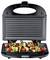 Open electric grill cooking skewers with chicken, cherry tomatoes, bell peppers, mushrooms, and onions.