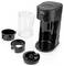 A black single-serve coffee maker with a transparent water jug, and three removable parts displayed beside it.