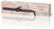 The image shows a 'Infinity of Beauty' 38W curling iron with black handle and barrel, next to its pink box featuring logo and polka dot design.