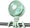 A portable, mint green fan with flexible legs wrapped around a rod, designed for versatile placement and personal cooling.