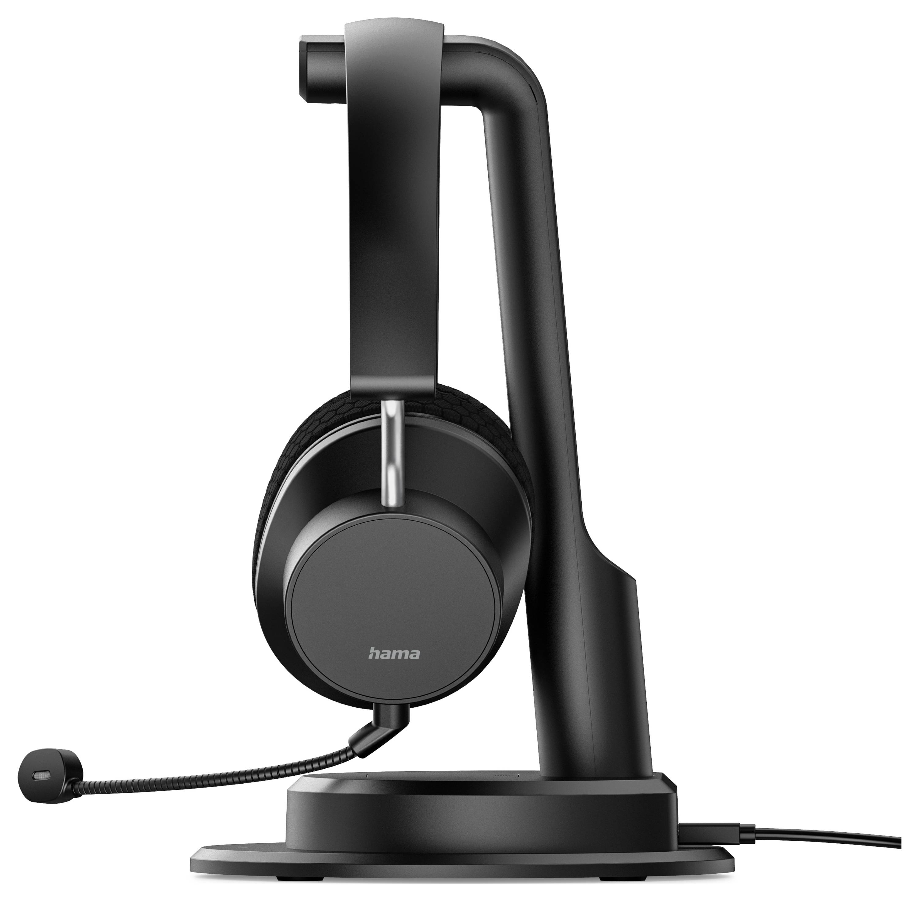 A black over-ear headset with a microphone rests on a sleek black stand, connected by a cable.