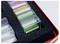 'A storage box contains neatly organized labeled card sets in plastic cases, one marked 'Kartensatz DIA 2.1' visible.'