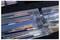 Collection of clear plastic boxes containing colorful, assorted slides arranged neatly in a foam-lined case.