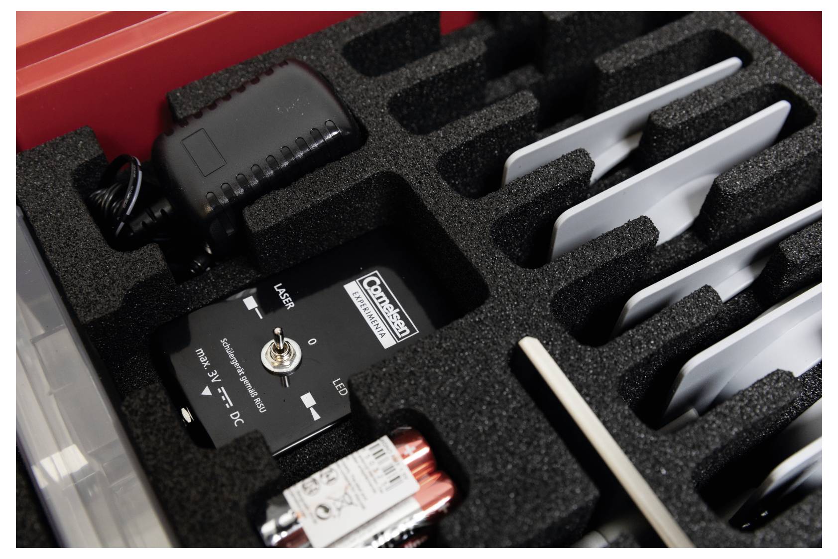 'Pitsco Free Fall Vehicle' and components in foam packaging. Includes charger, wheels, and remote.