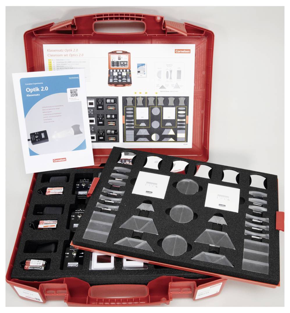 'A red case open to display an optical kit with various lenses, prisms, and a manual titled "Optik 2.0." Includes instructional materials.'