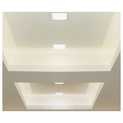 Ceiling with three recessed square lights, creating a multi-tiered effect through rectangular cutouts, illuminating the space.