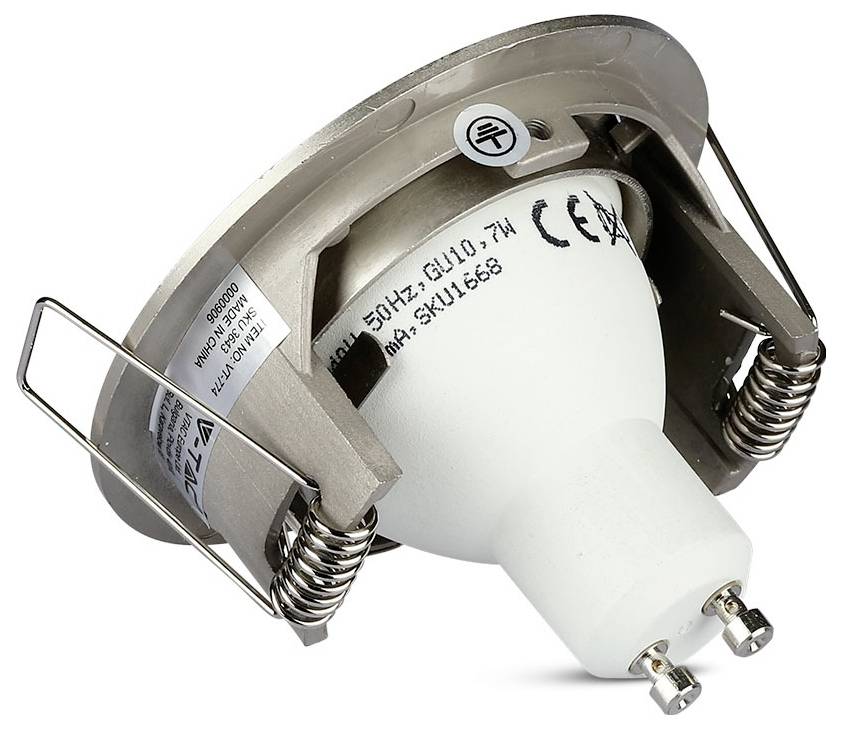 'Recessed metal spotlight fitting with two spring clips, showing a white GU10 bulb mounted inside. Label indicates CE certification.'