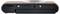 The image shows the bottom view of a compact brown and black camera with a round lens and battery compartment.