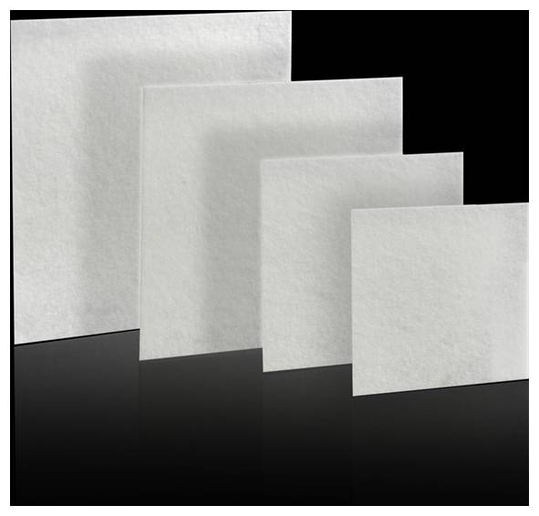 Four square sheets of white, semi-translucent material are arranged in descending size order from left to right, against a black background.