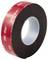 A roll of black foam tape with a red backing, displaying the '3M VHB' logo repeatedly. Used for bonding surfaces in various applications.