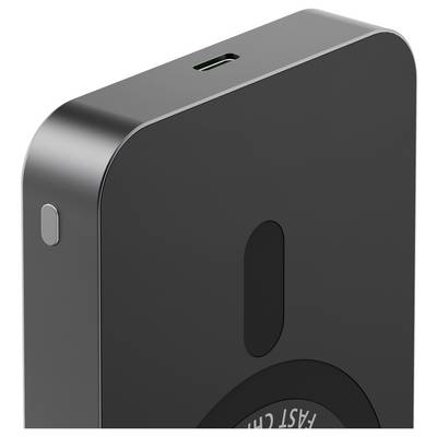 A close-up of a black device corner with a USB-C charging port and a 'Fast Charge' label, possibly a wireless charger or power bank.