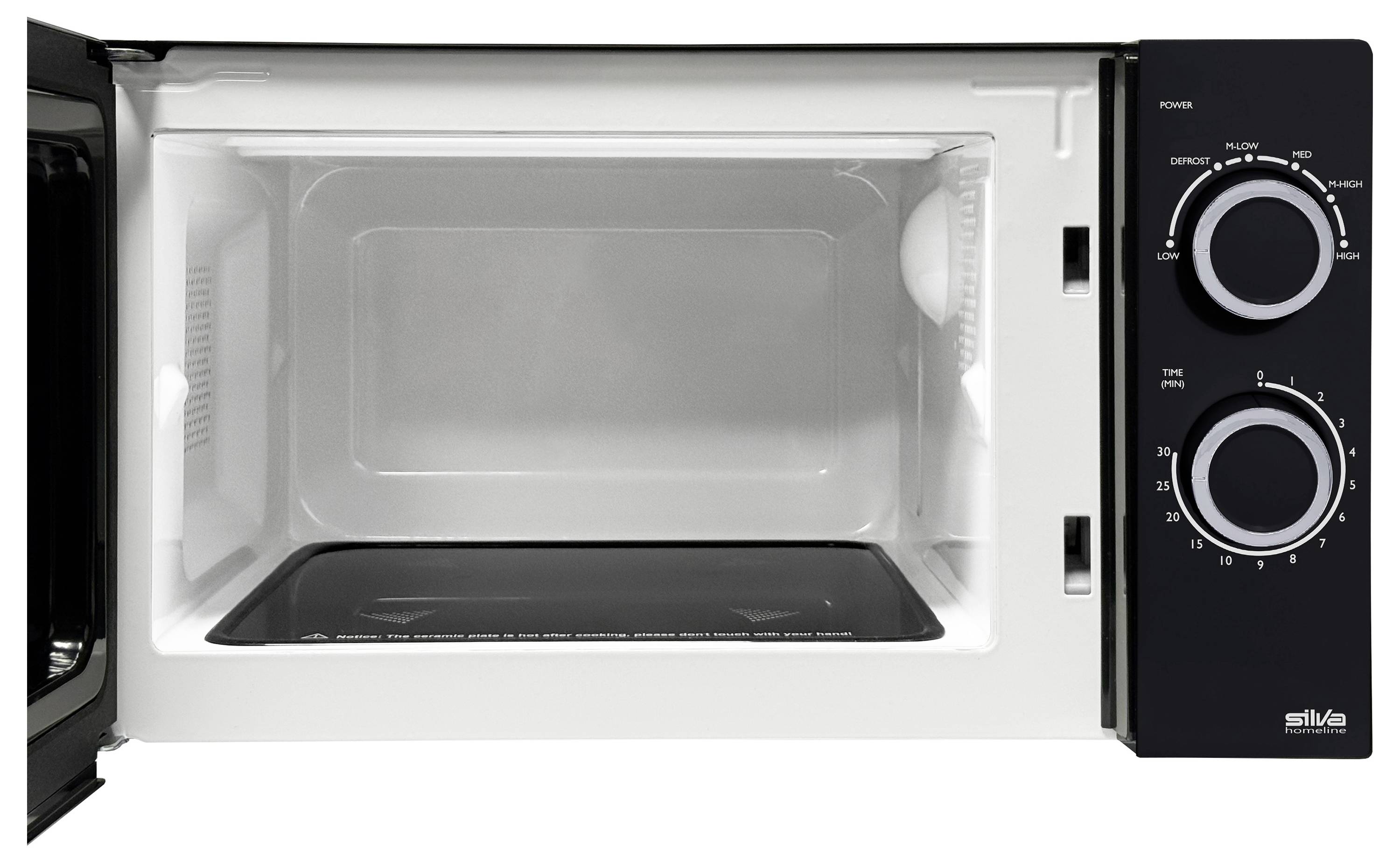 A microwave oven with an open door, showing its empty interior. The control panel on the right features two rotary knobs for settings and timer.