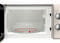 Open microwave oven with an empty rotating glass plate inside. Control knobs on the right show time and power settings.